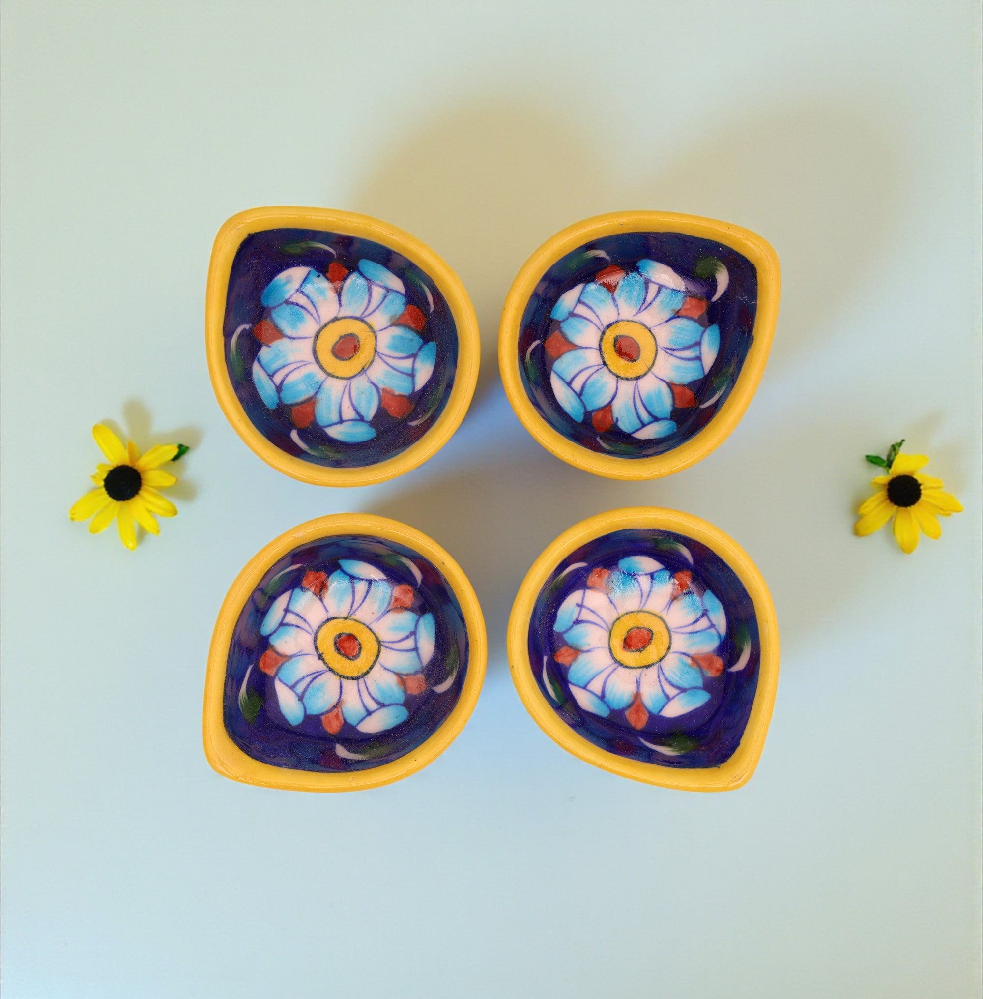 Handcrafted Leaf-Shaped Dual-Tone Blue Pottery Diyas Set – Yellow & Navy