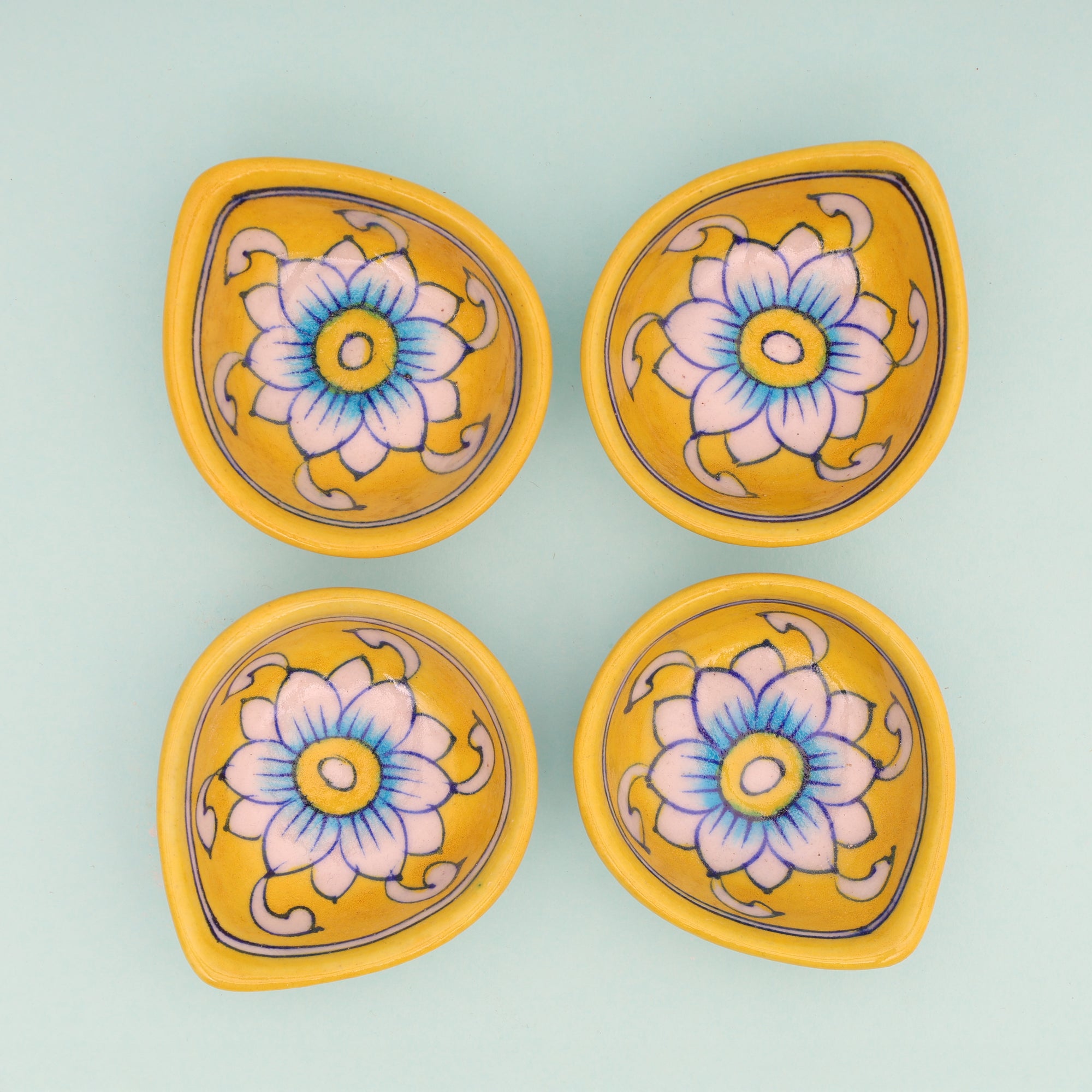 Handcrafted Yellow Leaf-Shaped Blue Pottery Diyas Set